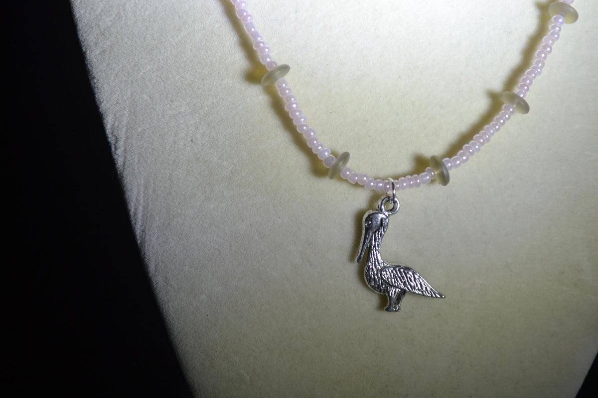 Silver Pelican pendant glass bead necklace. Pearl pink and sea glass
