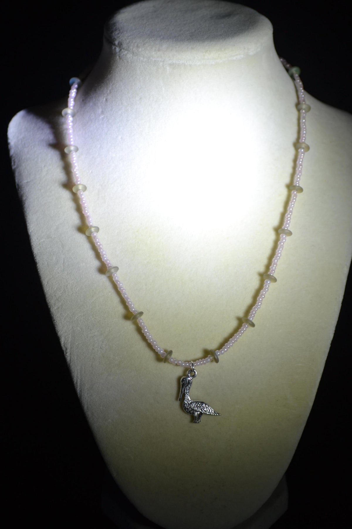 Silver Pelican pendant glass bead necklace. Pearl pink and sea glass