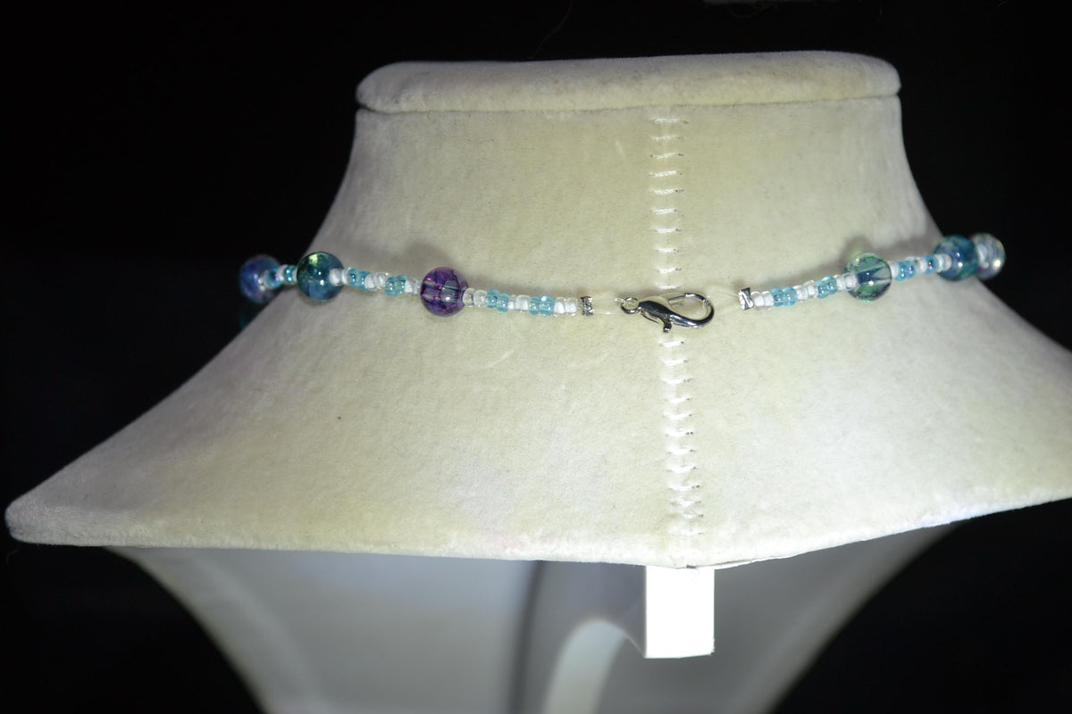 Silver Snail Shell pendant glass bead necklace. Blues and white