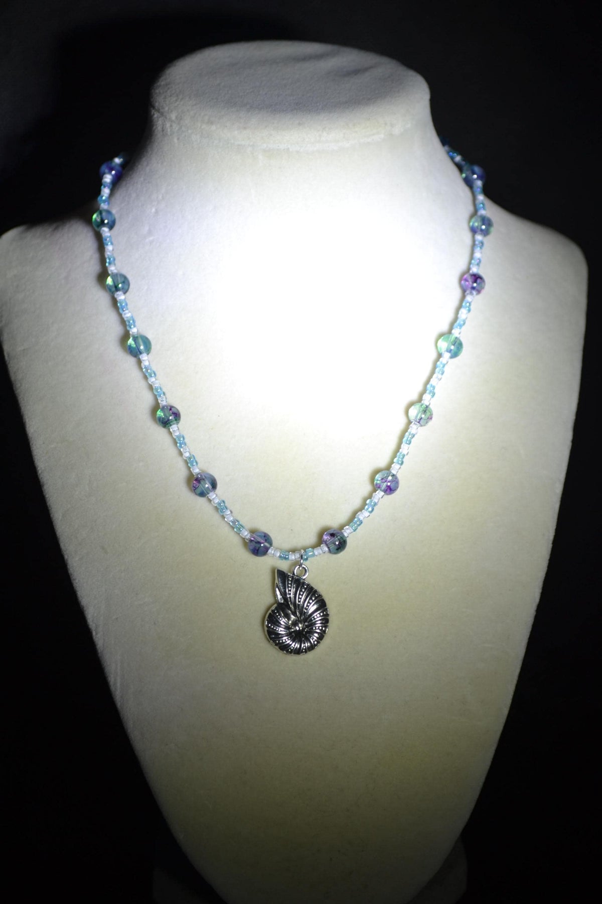 Silver Snail Shell pendant glass bead necklace. Blues and white