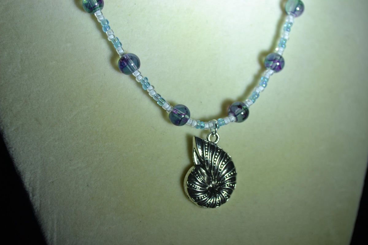 Silver Snail Shell pendant glass bead necklace. Blues and white