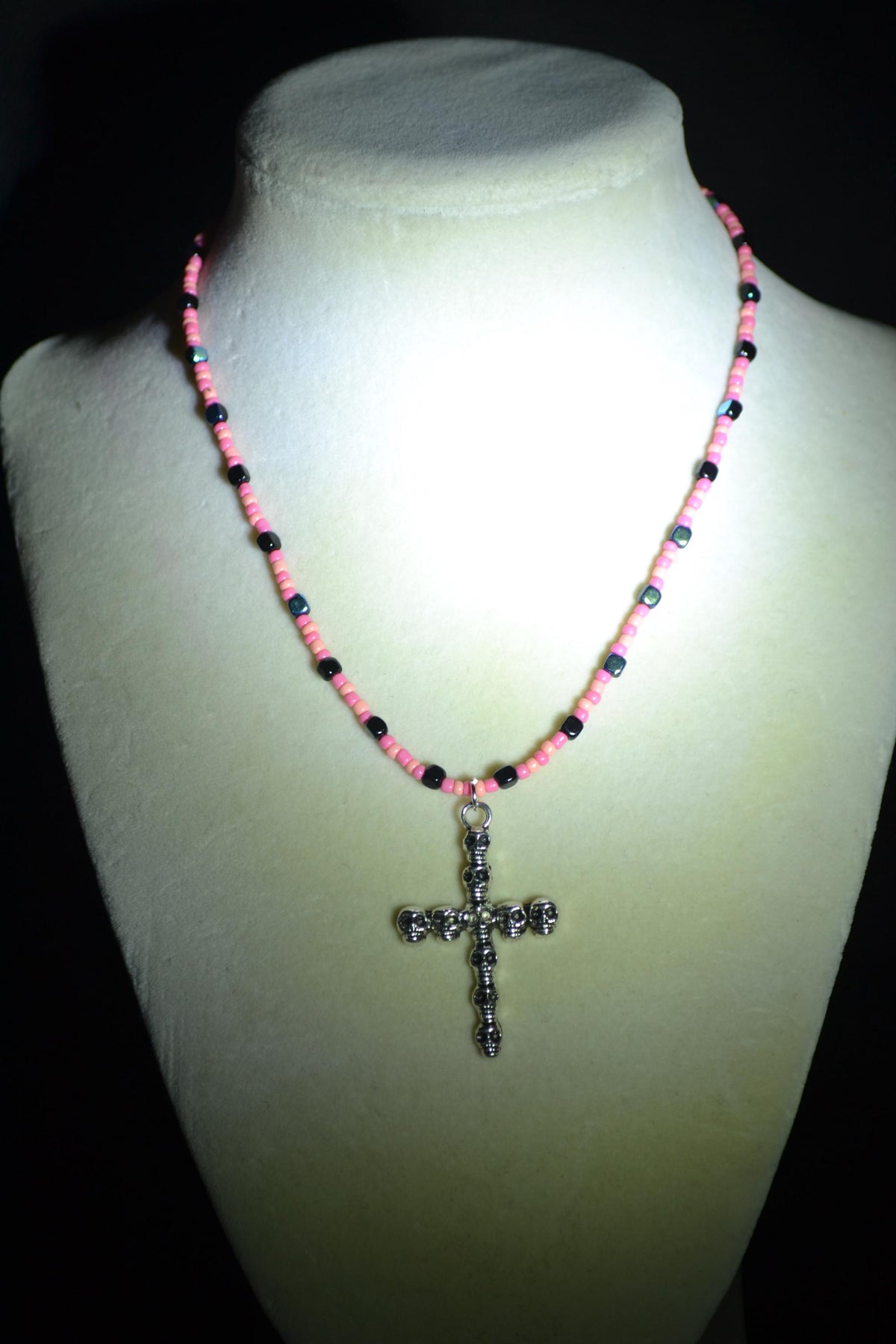 Silver Skull Cross pendant glass bead necklace. Coral, pink, and metallic black