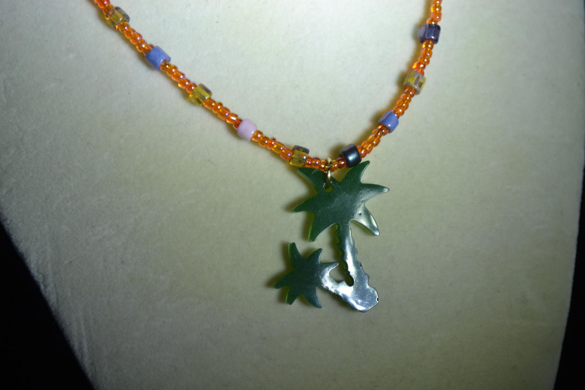 Green Palms pendant glass bead necklace. Orange and Picasso mix
