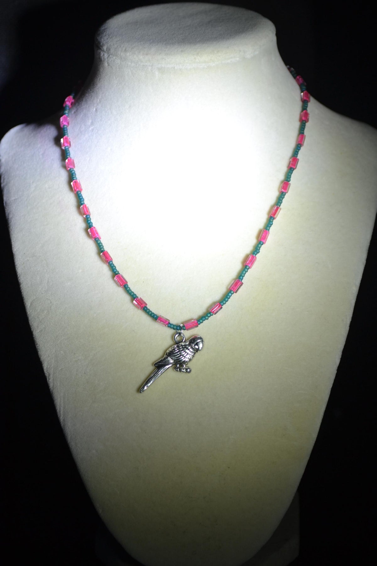 Silver Parrot pendant glass bead necklace. Teal and fuchsia