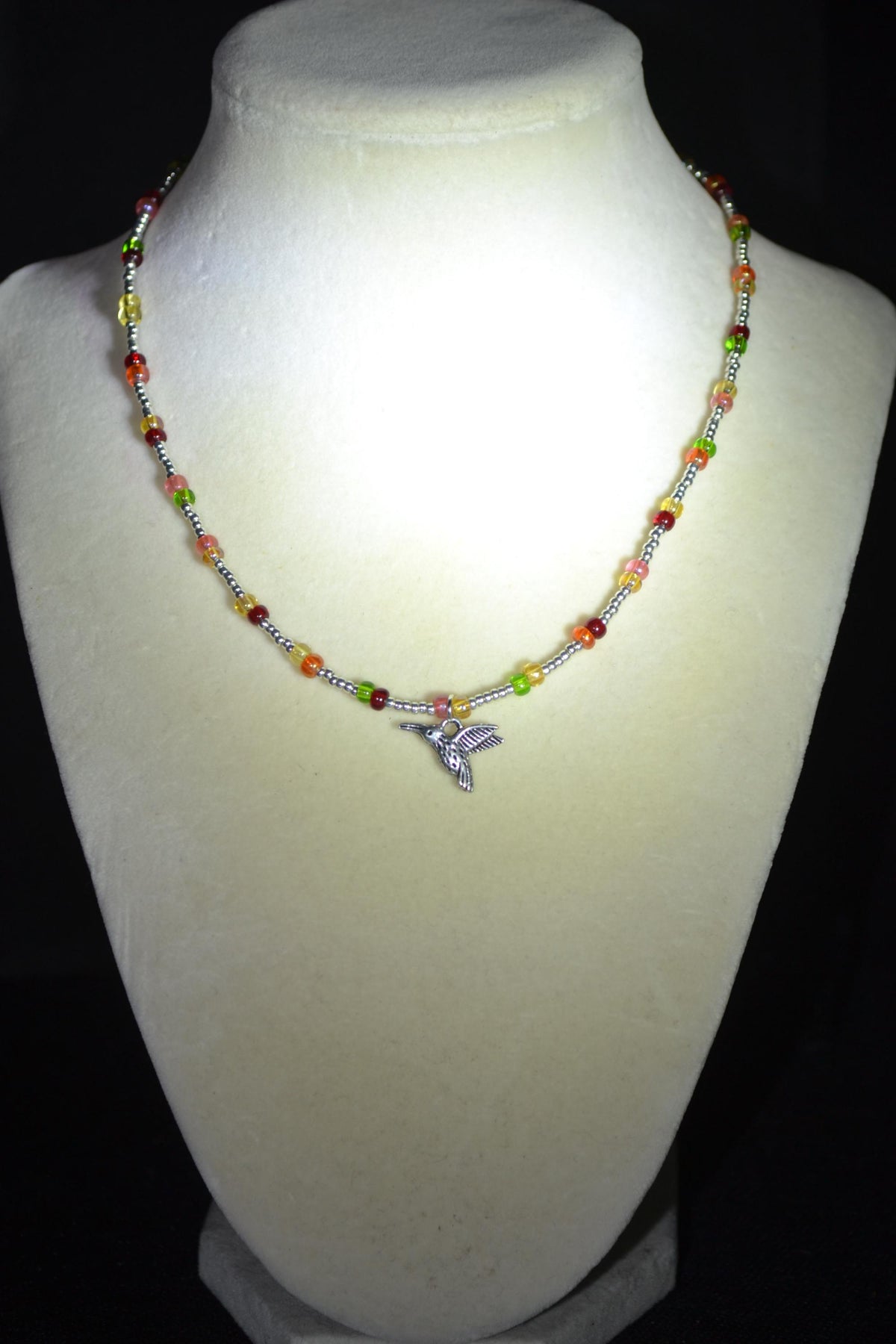 Silver Hummingbird pendant glass bead choker. Silver and skittles