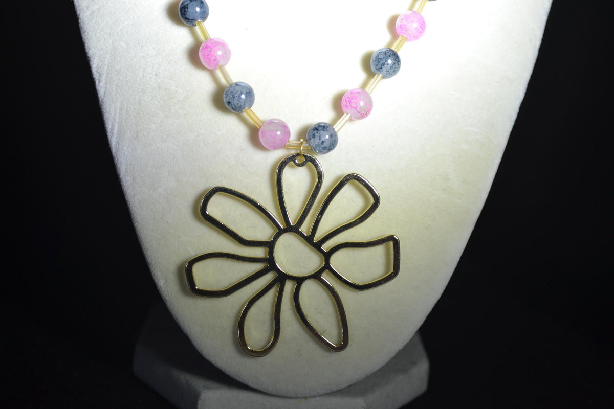 Gold Flower pendant glass bead necklace. Pink, black, and champagne
