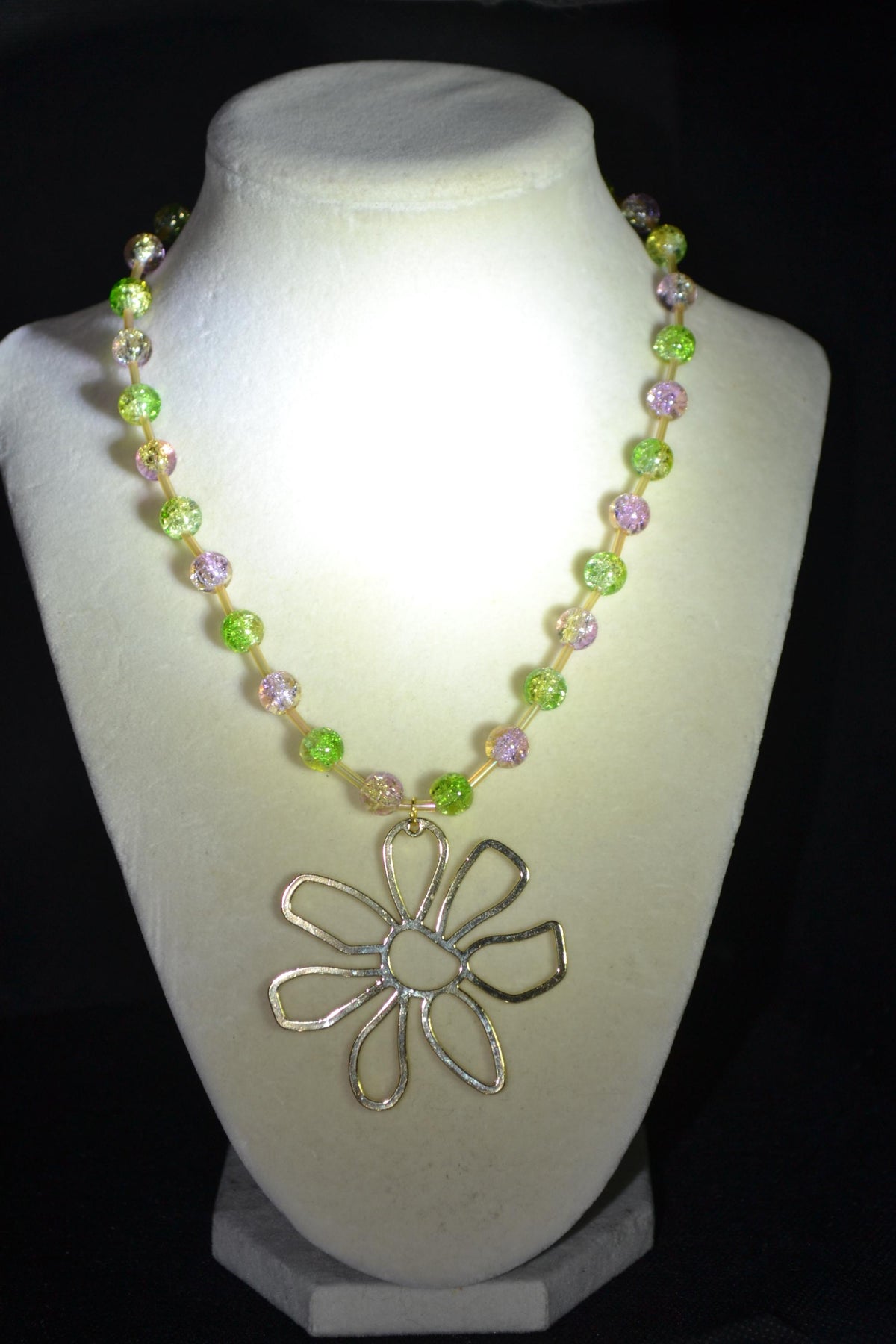 Gold Flower pendant glass bead necklace. Green, purple, and champagne