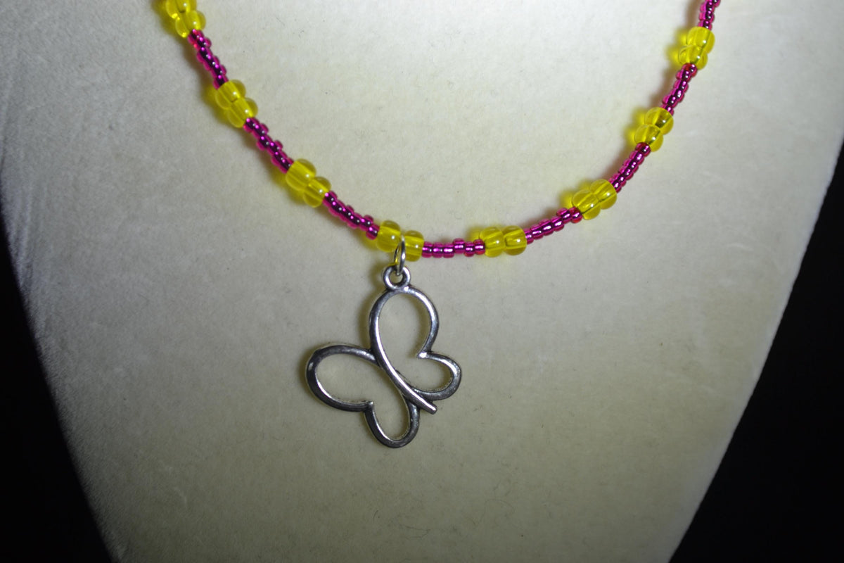 Silver Butterfly pendant glass bead necklace. Pink lemonade