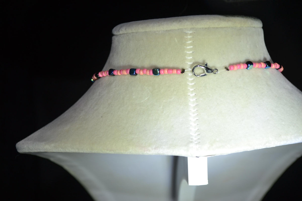 Silver Skull Cross pendant glass bead necklace. Coral, pink, and metallic black
