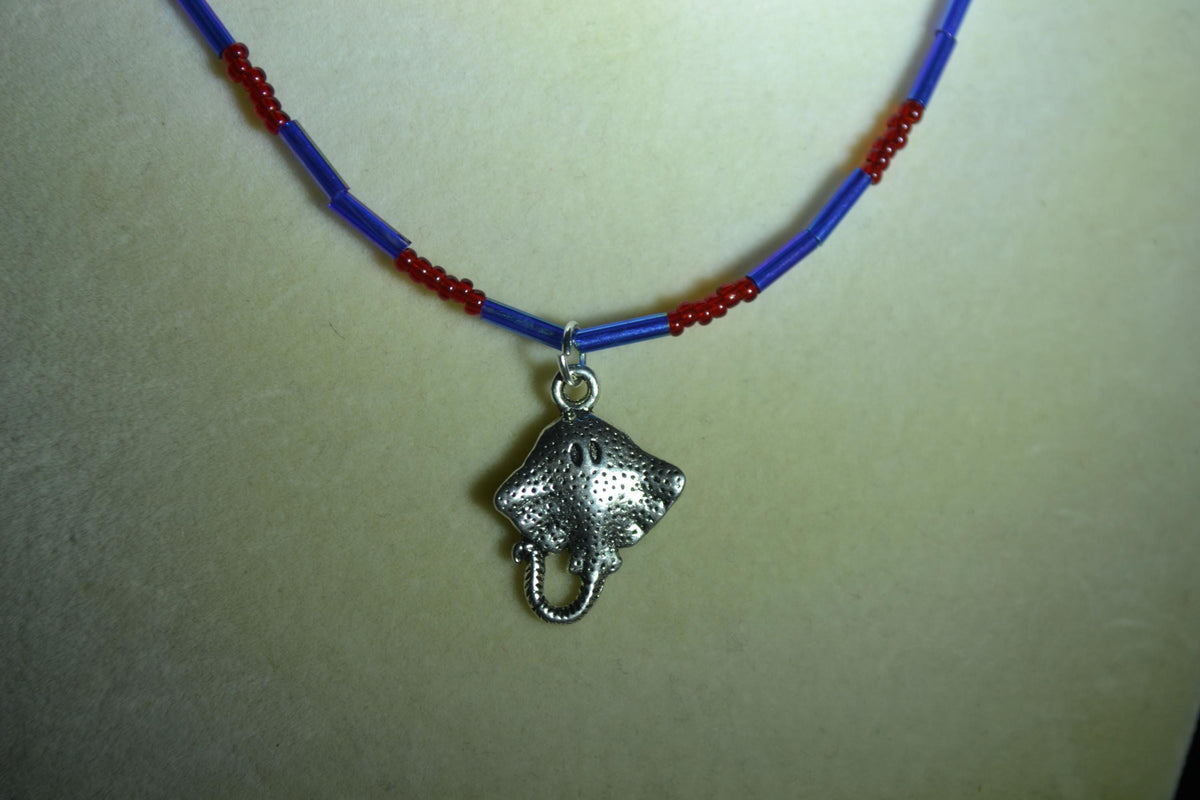 Silver Stingray pendant glass bead necklace. Red and blue