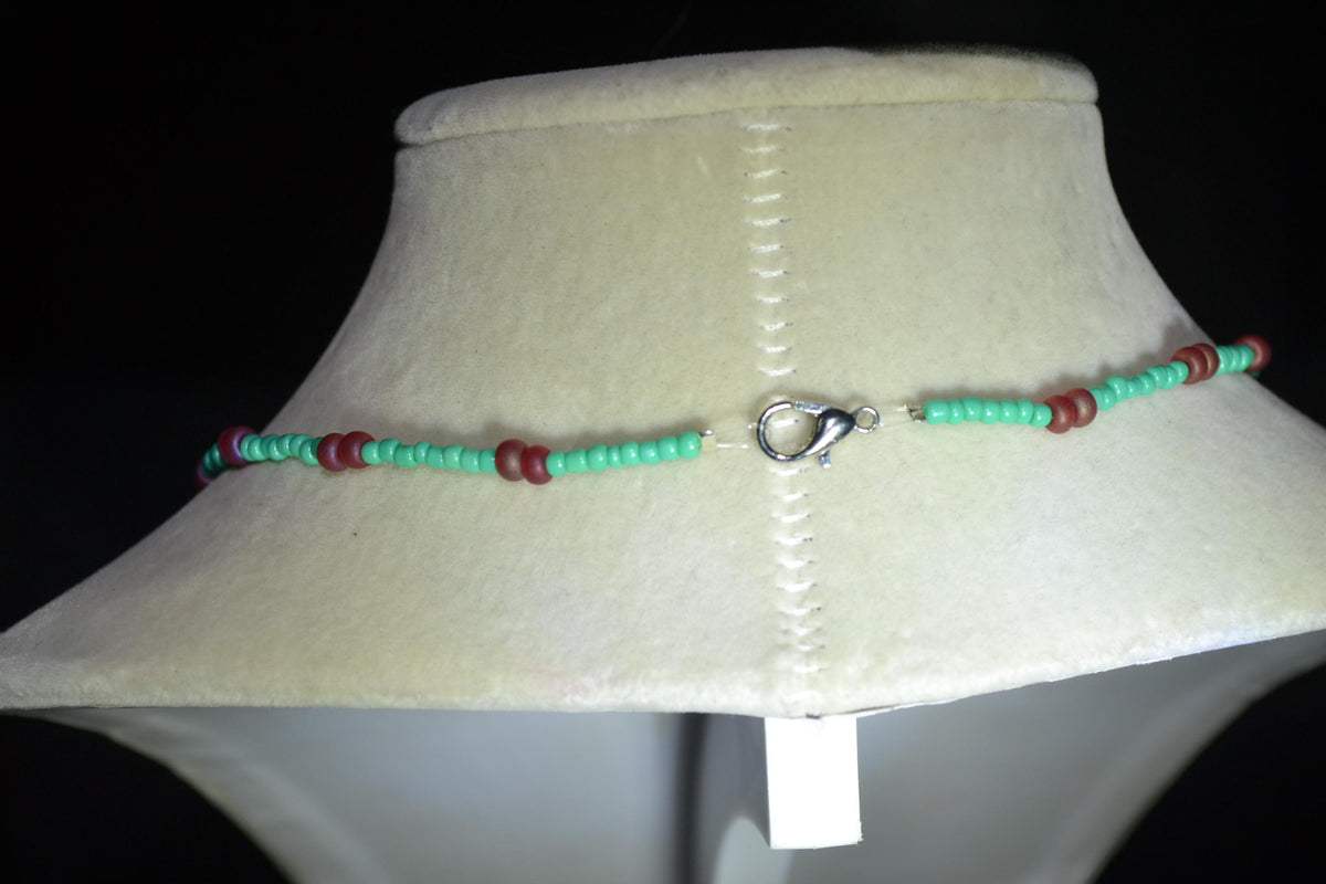 Wire wrapped sharks tooth beaded necklace. Teal and frosted red