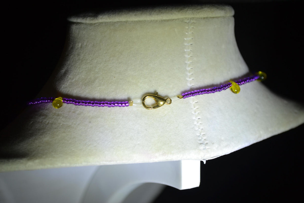 Multicolor glass bead necklace. Purple and yellow drops