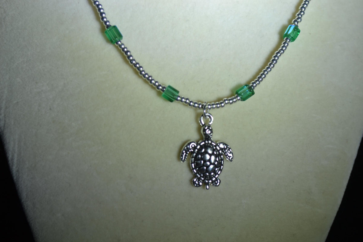 Silver Turtle pendant glass bead necklace. Aqua and silver