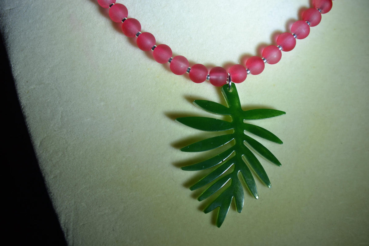 Green Monstera pendant glass bead choker. Frosted Red and silver