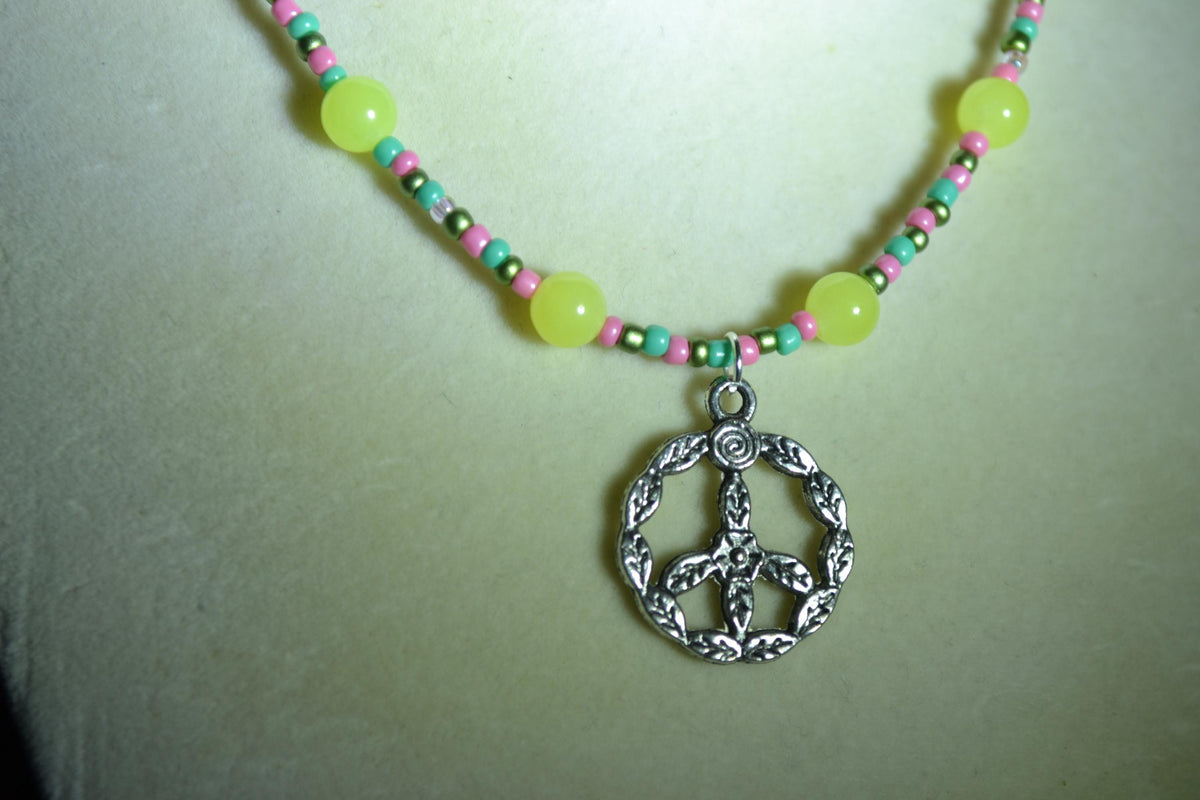 Silver Peace Sign pendant glass bead necklace. Yellow, teal, pink, and green