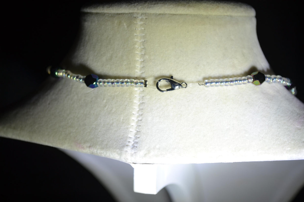 Silver Bat pendant glass bead necklace. Metallic black and crystal