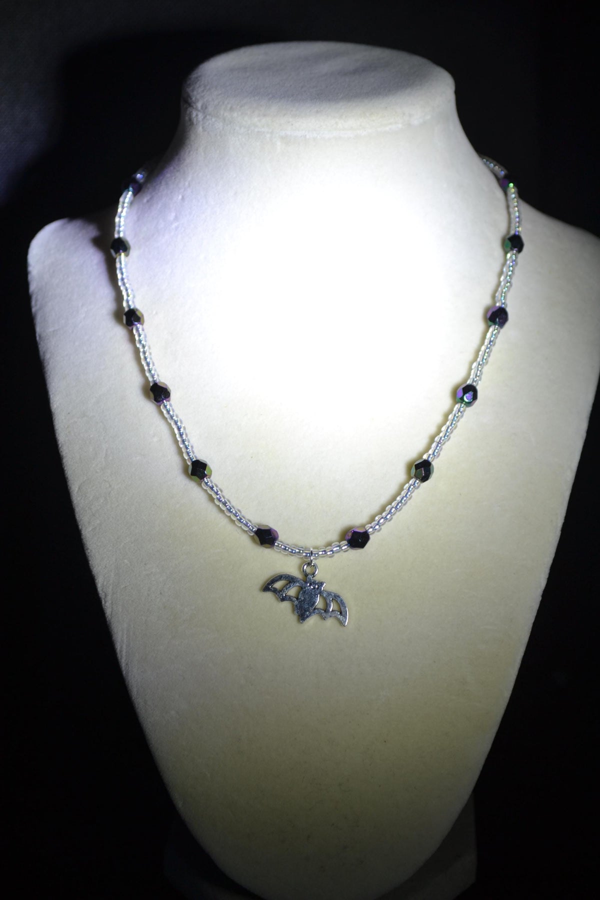Silver Bat pendant glass bead necklace. Metallic black and crystal