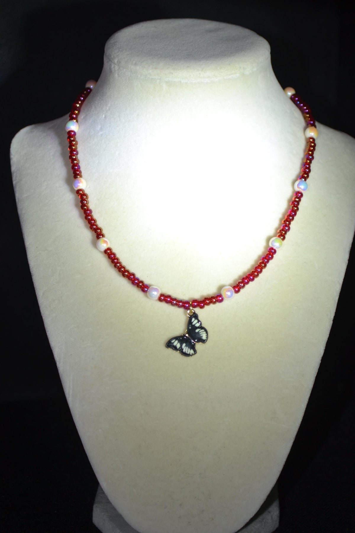 Black Butterfly pendant glass bead necklace. Pearl and red