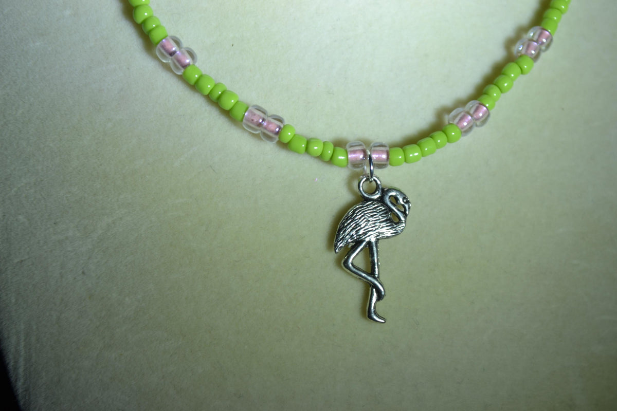 Silver Flamingo pendant glass bead necklace. Green and pink