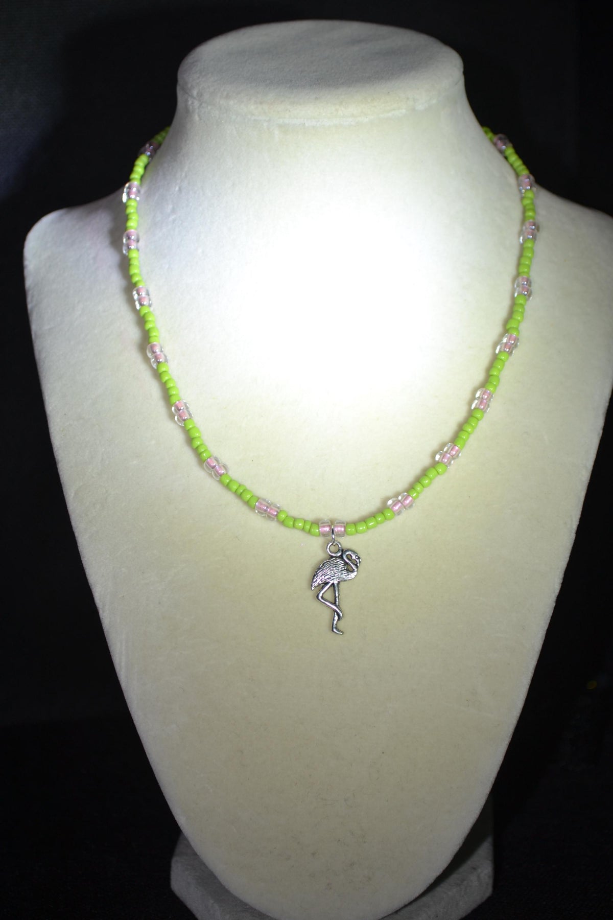 Silver Flamingo pendant glass bead necklace. Green and pink