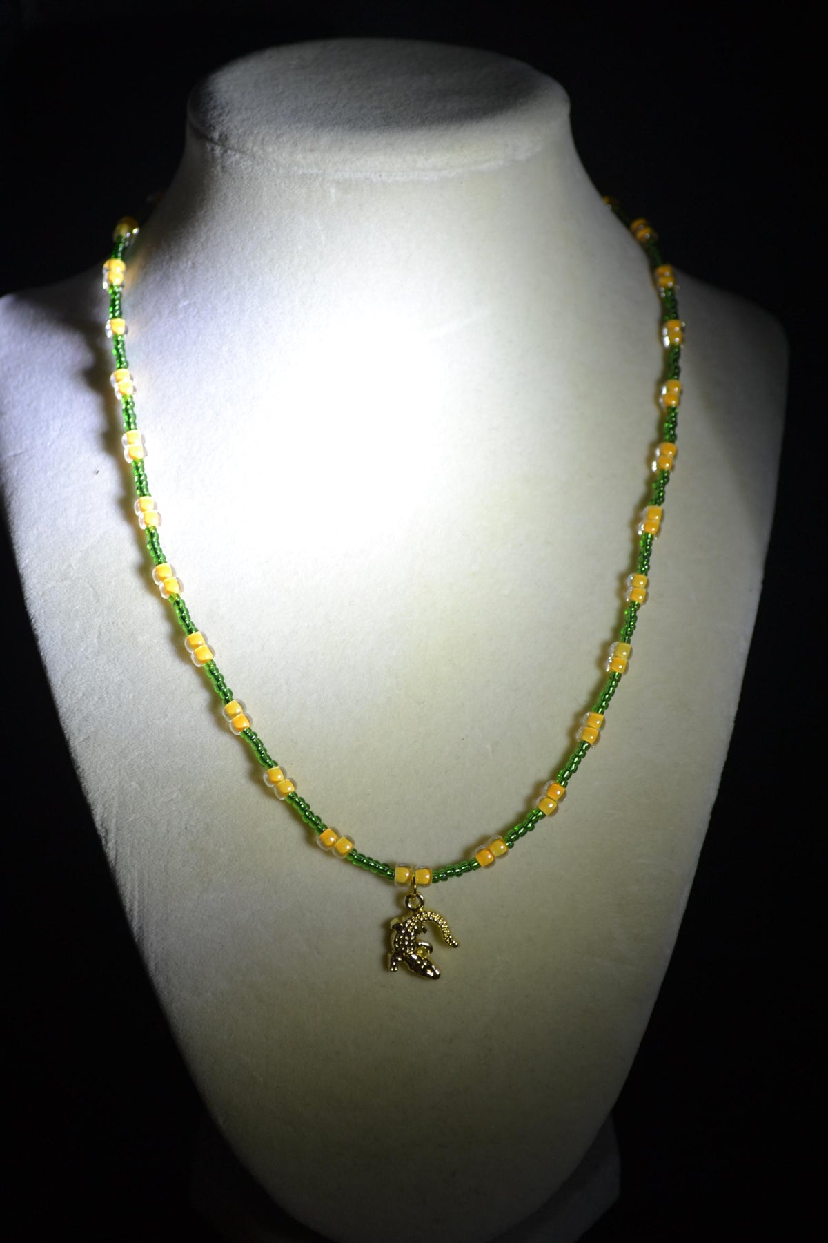 Gold alligator pendant glass bead necklace. Green and yellow