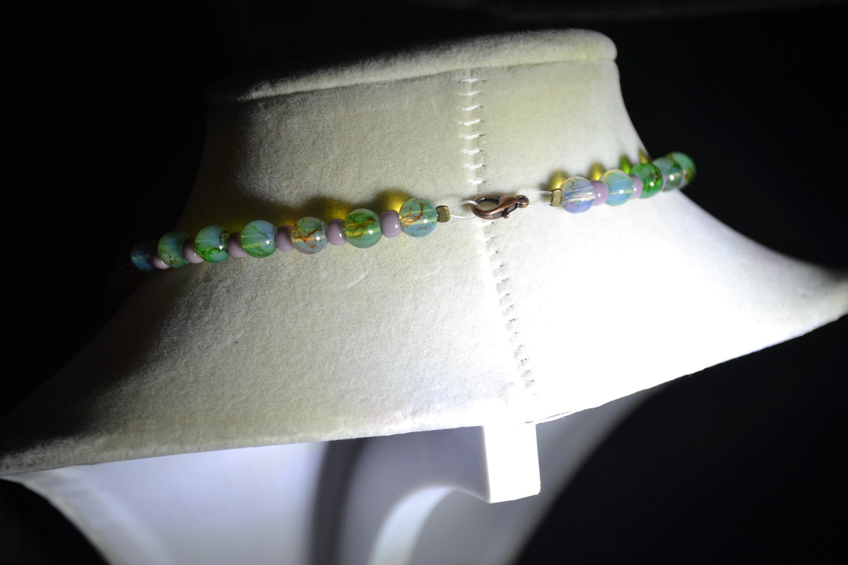 Bronze Dragonfly pendant glass bead necklace. Green and purple