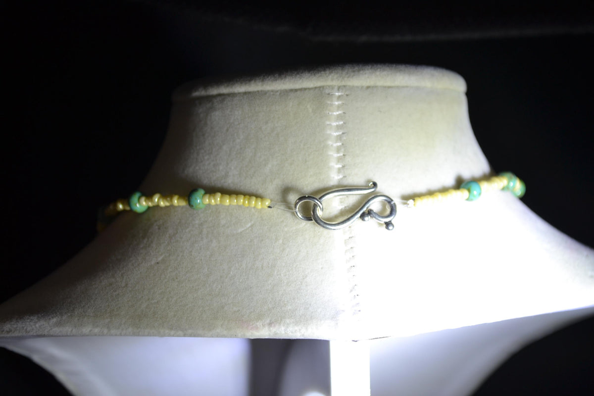 Silver Armadillo pendant glass bead necklace. Yellow and turquoise