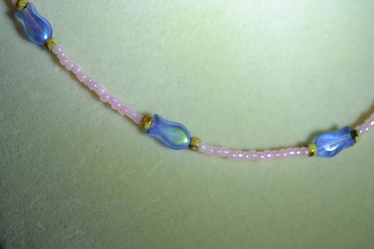 Beaded fish necklace. Pearl pink, iridescent blue, and Picasso