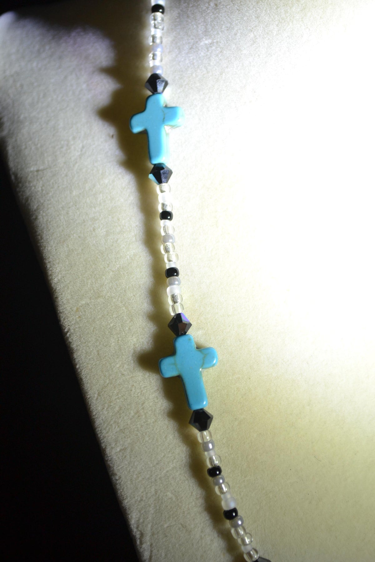 Beaded Cross glass necklace. Turquoise, white, and black