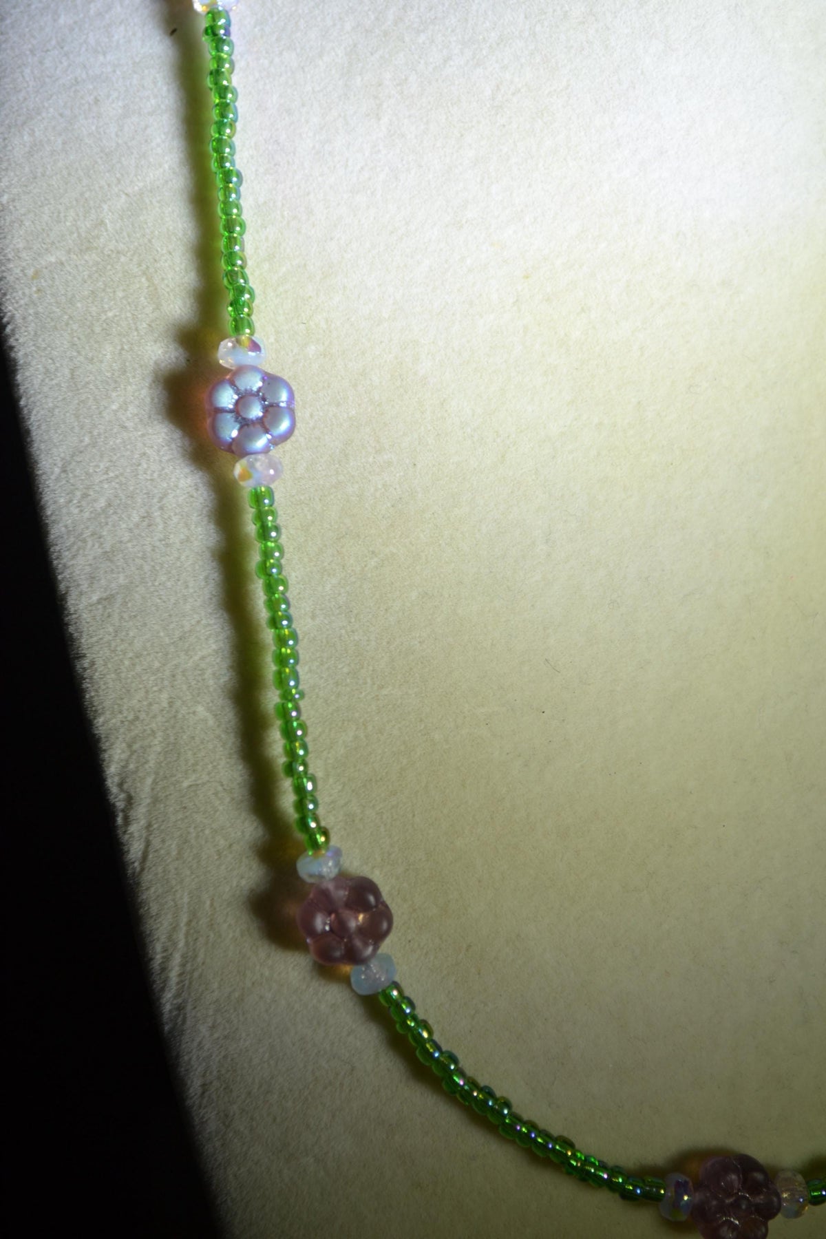 Beaded flower glass necklace. Iridescent purple, green, and sky blue. Reversible