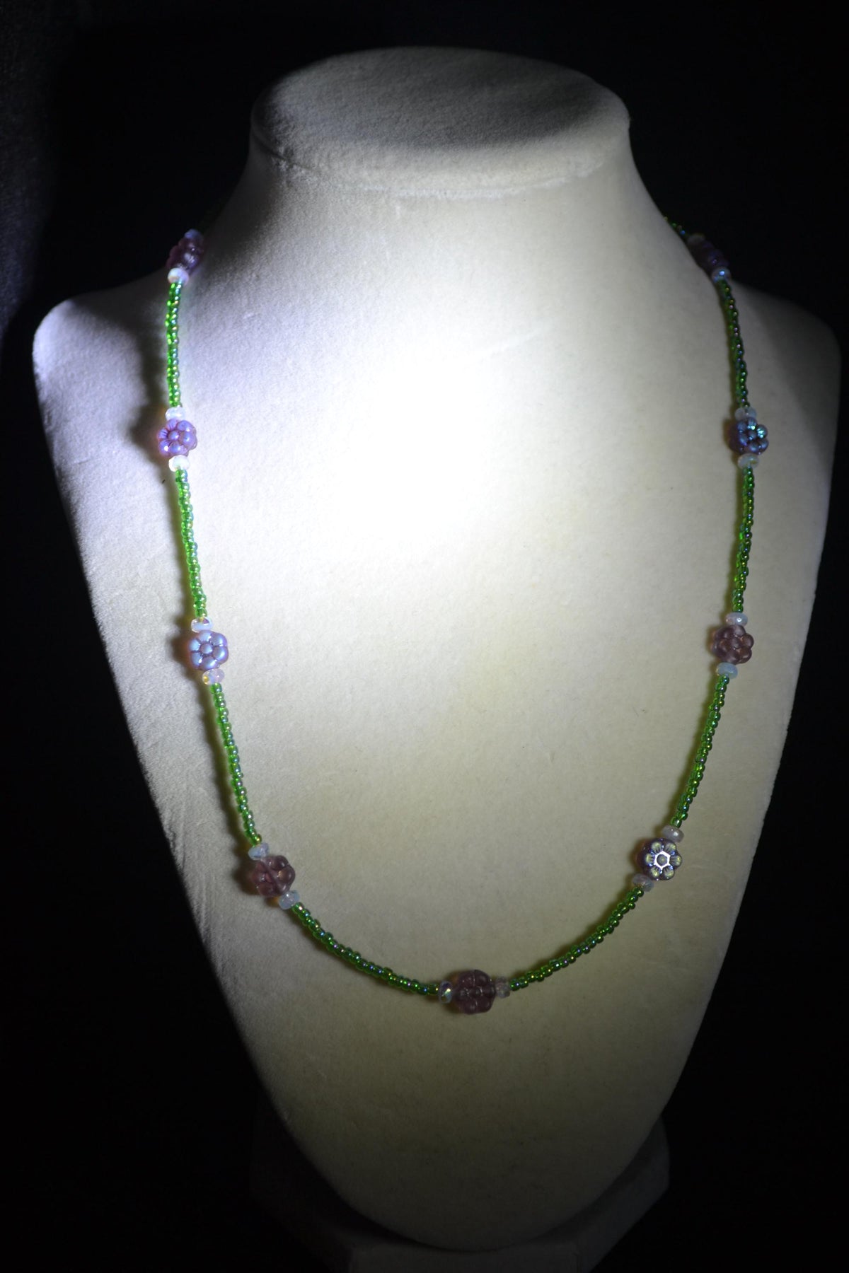 Beaded flower glass necklace. Iridescent purple, green, and sky blue. Reversible
