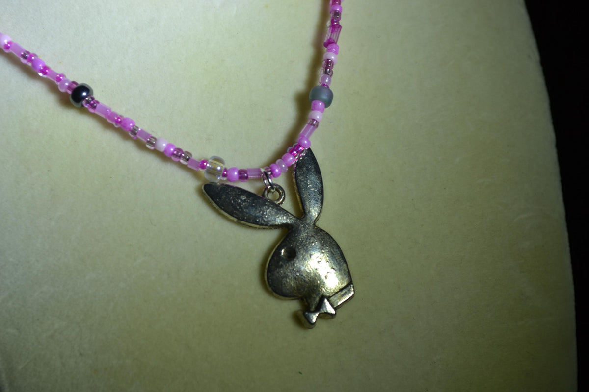 Silver Playboy pendant glass bead necklace. Mixed pinks