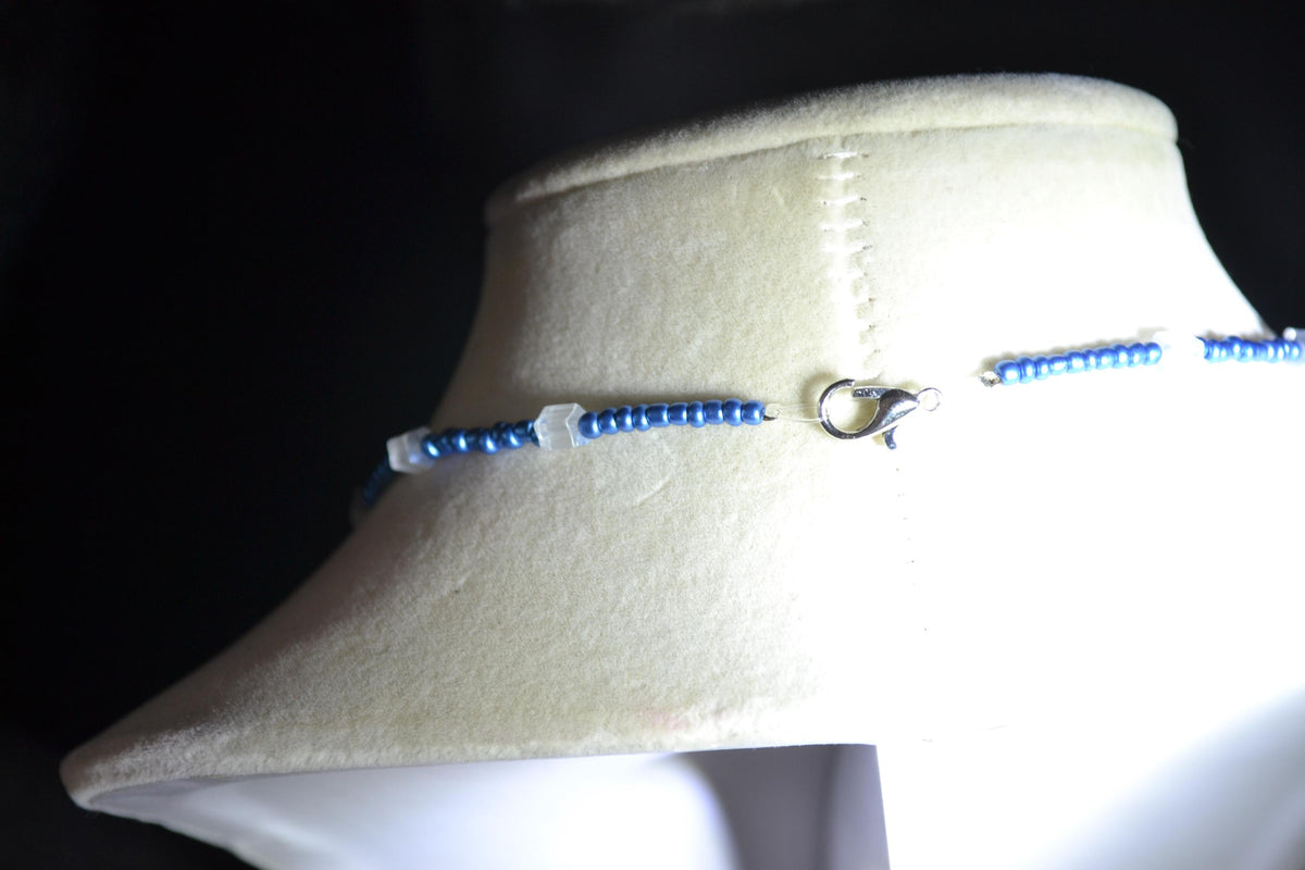 Silver Turtle pendant glass bead necklace. Metallic blue and cat eye
