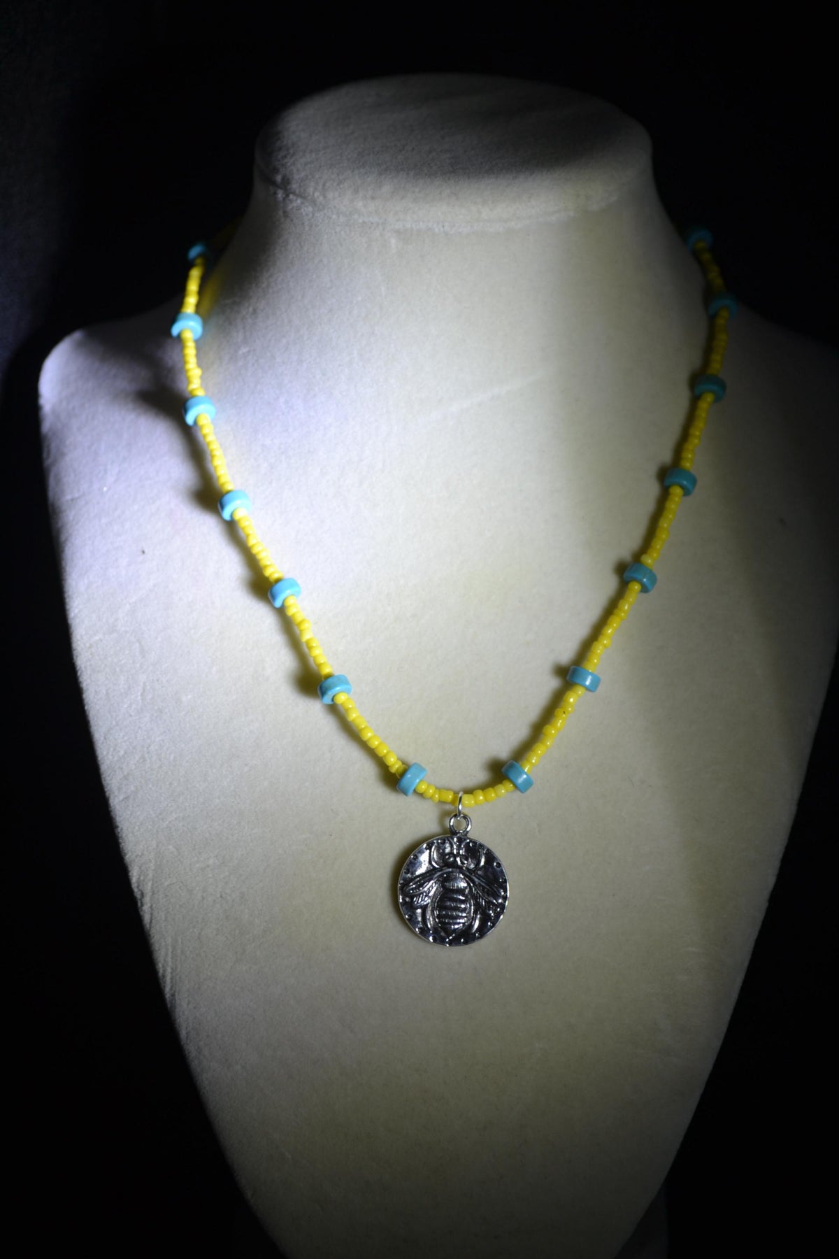 Silver bee pendant glass bead necklace. Turquoise and yellow
