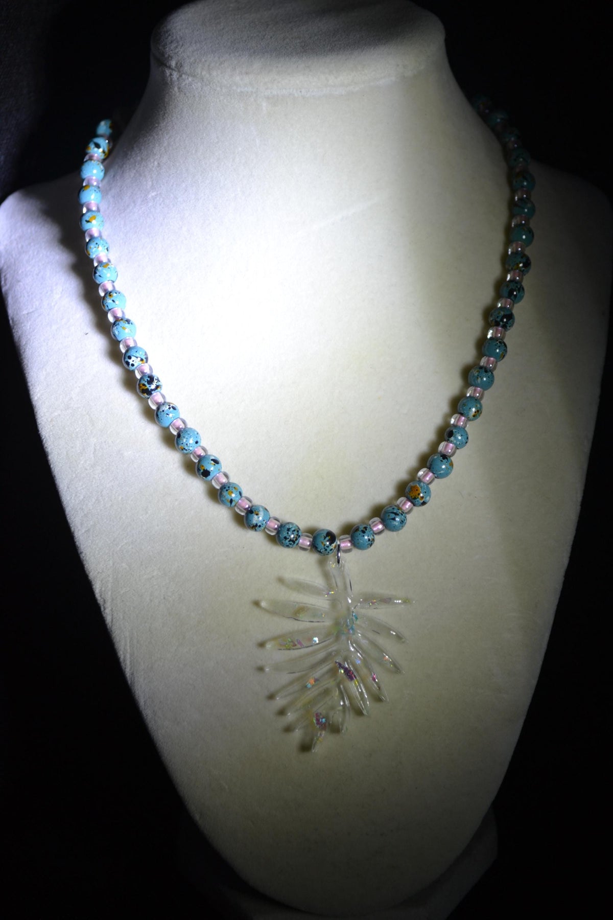 Iridescent philodendron pendant glass bead necklace. Turquoise and pink