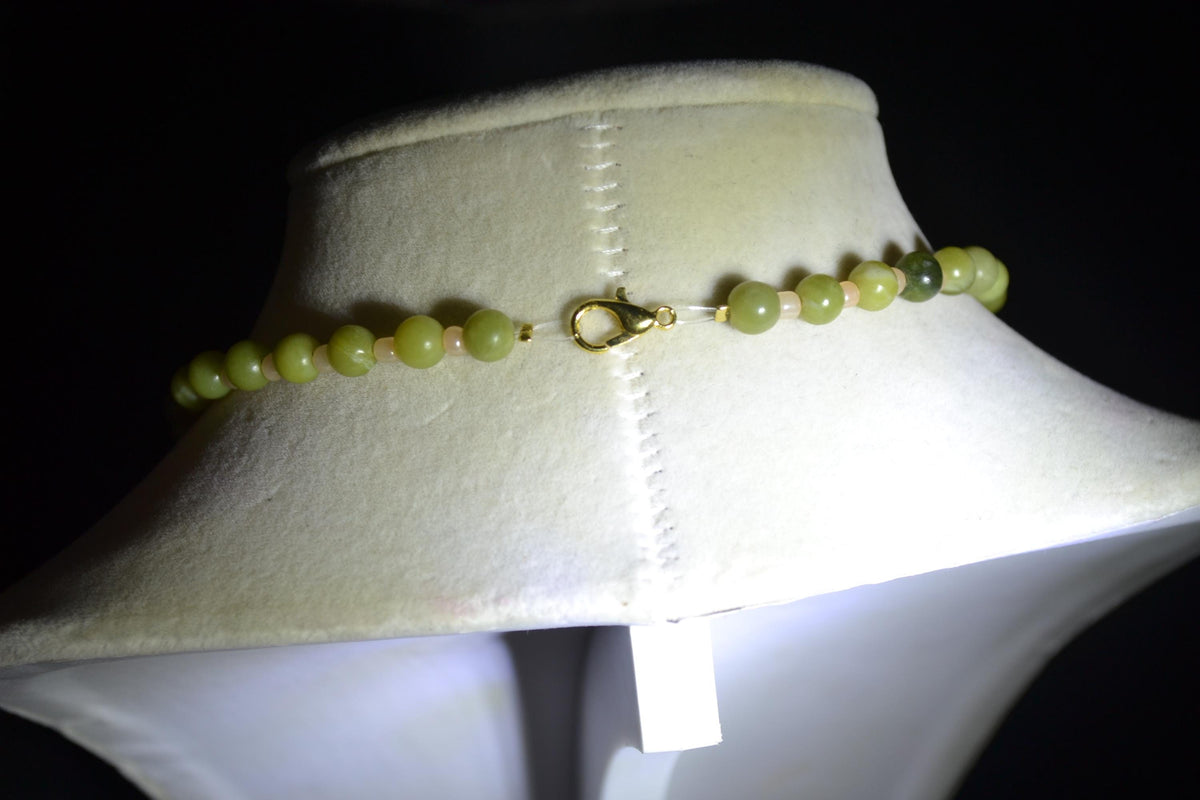Carved Plumeria pendant glass bead necklace. Green jade and sand
