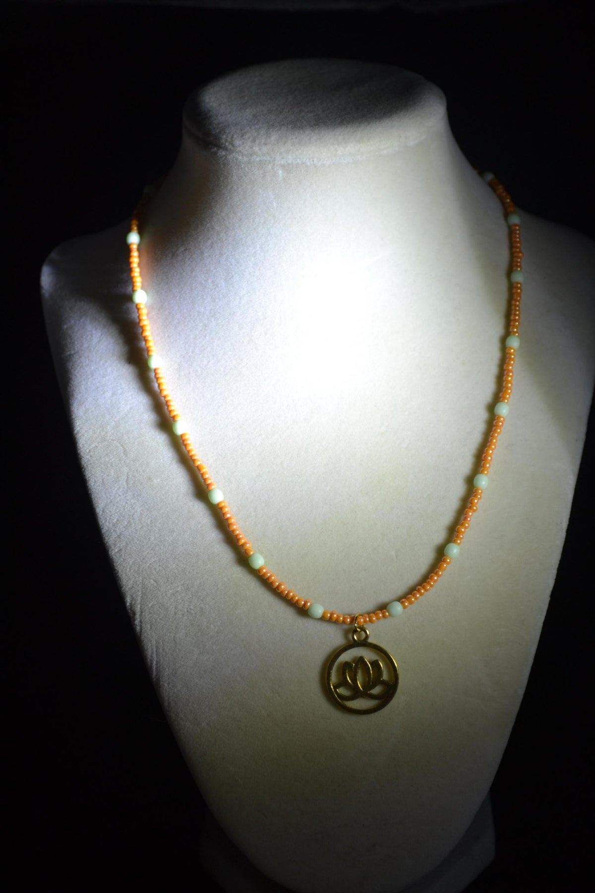 Gold Lotus pendant glass bead necklace. Mint and tangerine