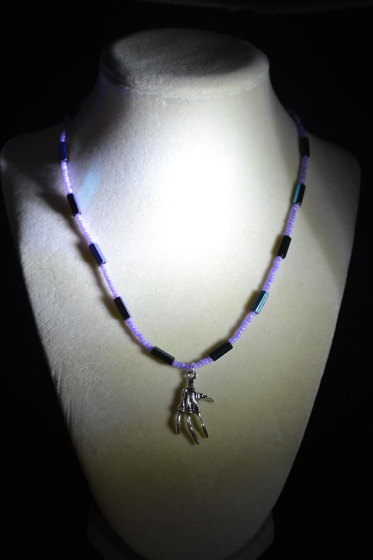 Silver talon skeleton pendant glass bead necklace. Lavender and metallic black