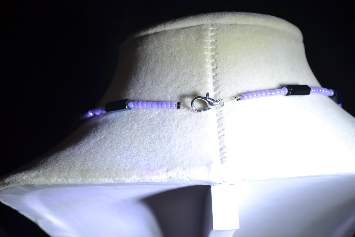 Silver talon skeleton pendant glass bead necklace. Lavender and metallic black
