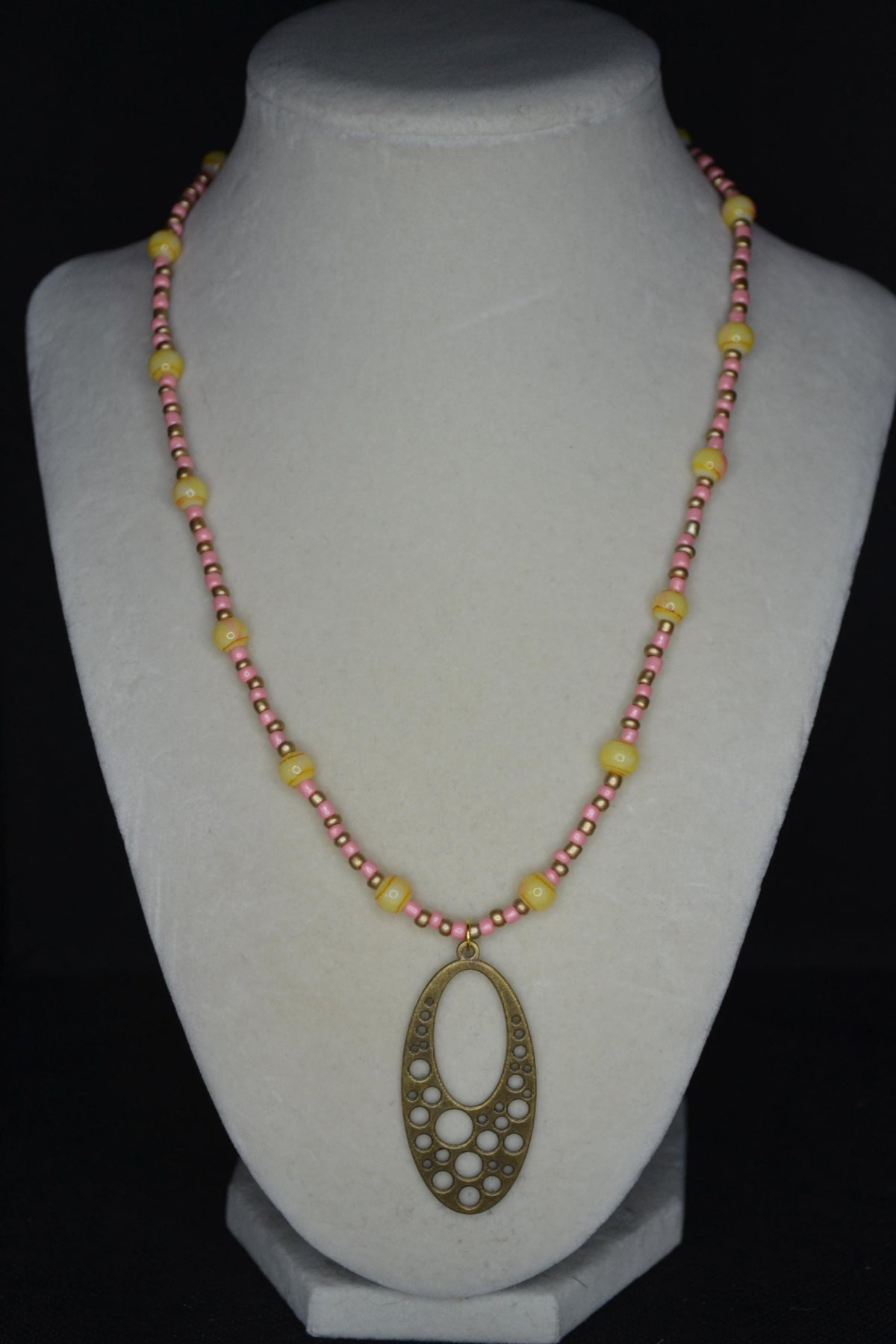 Gold Brass bubble pendant glass bead necklace. Coral, gold, and yellow tie dye