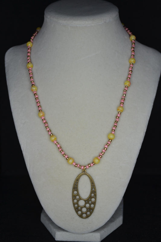 Gold Brass bubble pendant glass bead necklace. Coral, gold, and yellow tie dye