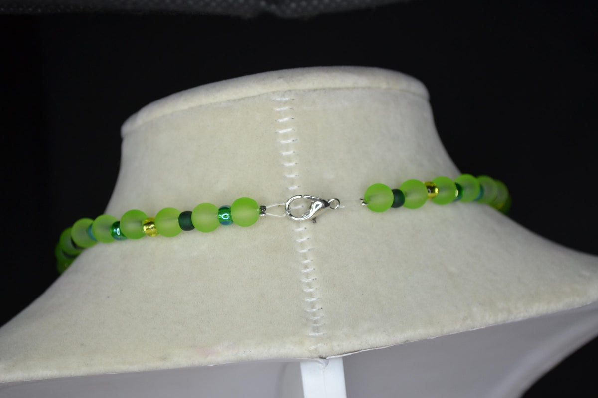 Silver Chameleon pendant glass bead necklace. Greens