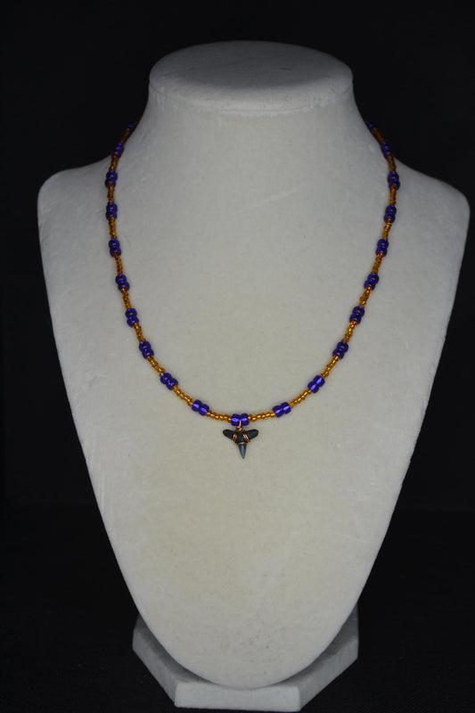 Wire wrapped sharks tooth beaded necklace. Brown and indigo