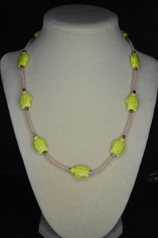 Beaded Sea Turtle necklace. Frosted pink, amber, and green