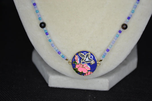 Gold Hummingbird pendant glass bead necklace. Blues and black agate
