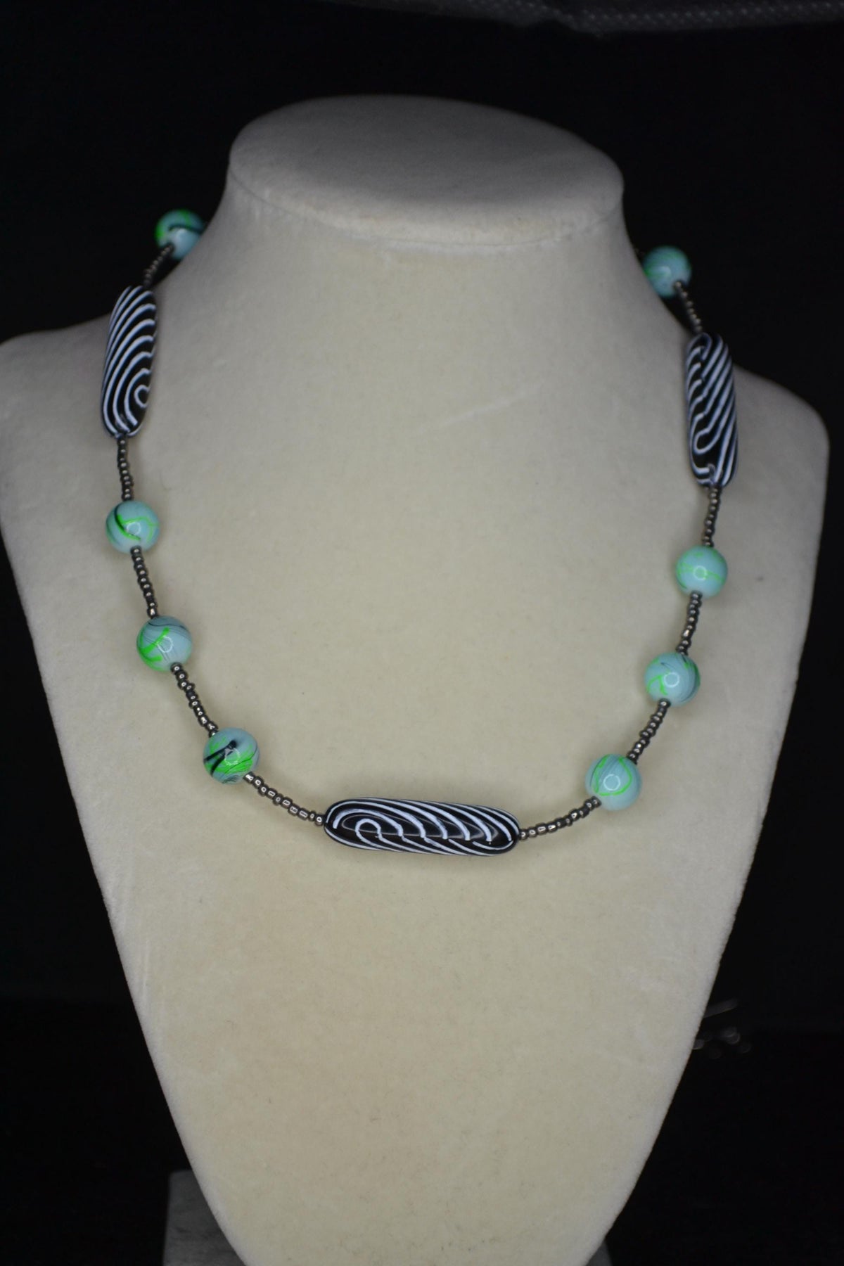 Multicolor glass and wood bead necklace. Metallic grey, tie dye, and black & white stripes