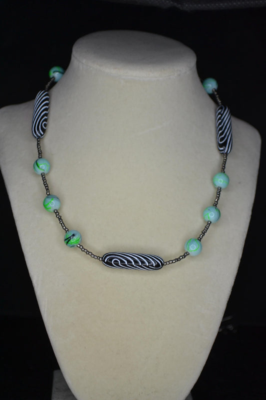 Multicolor glass and wood bead necklace. Metallic grey, tie dye, and black & white stripes