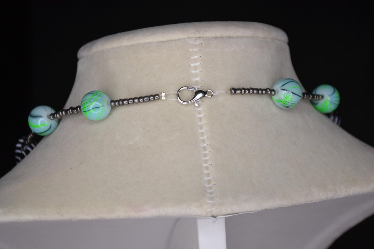 Multicolor glass and wood bead necklace. Metallic grey, tie dye, and black & white stripes