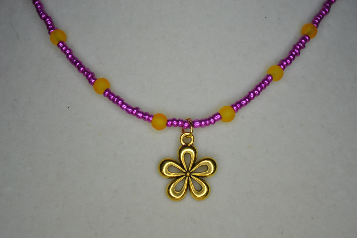 Gold flower pendant glass bead choker. Metallic pink and frosted orange