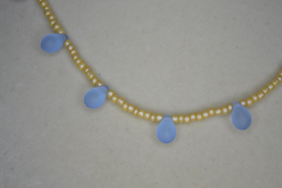 Multicolor glass bead necklace. Pearl yellow and frosted blue drops